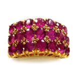 A multi row ruby set dress ring, three rows of seven round faceted stones of 1.6mm diameter average,