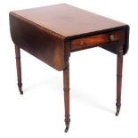 A George IV mahogany Pembroke table, with single frieze drawer raised on ring turned legs, brass cap