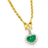 A heart shaped emerald and diamond pendant on chain, the cabachon emerald of 8.7mm x 6.7mm surrounde