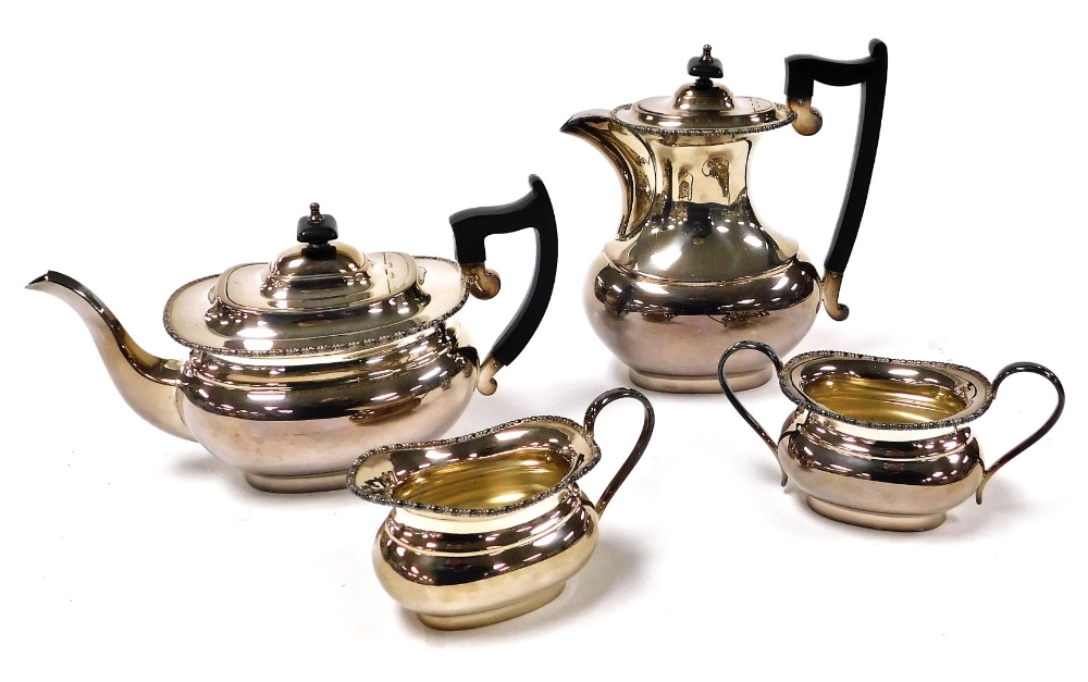 A Viners of Sheffield silver plated four piece tea set, with a gadrooned rim, comprising tea pot, ho