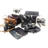 A Polaroid land camera, Agfa X-126 Auto Star camera, Schinon 35f-ee camera, pair of Denhil binocular