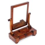 A Victorian mahogany dressing table mirror, the rectangular mirror on a base with two small cushion
