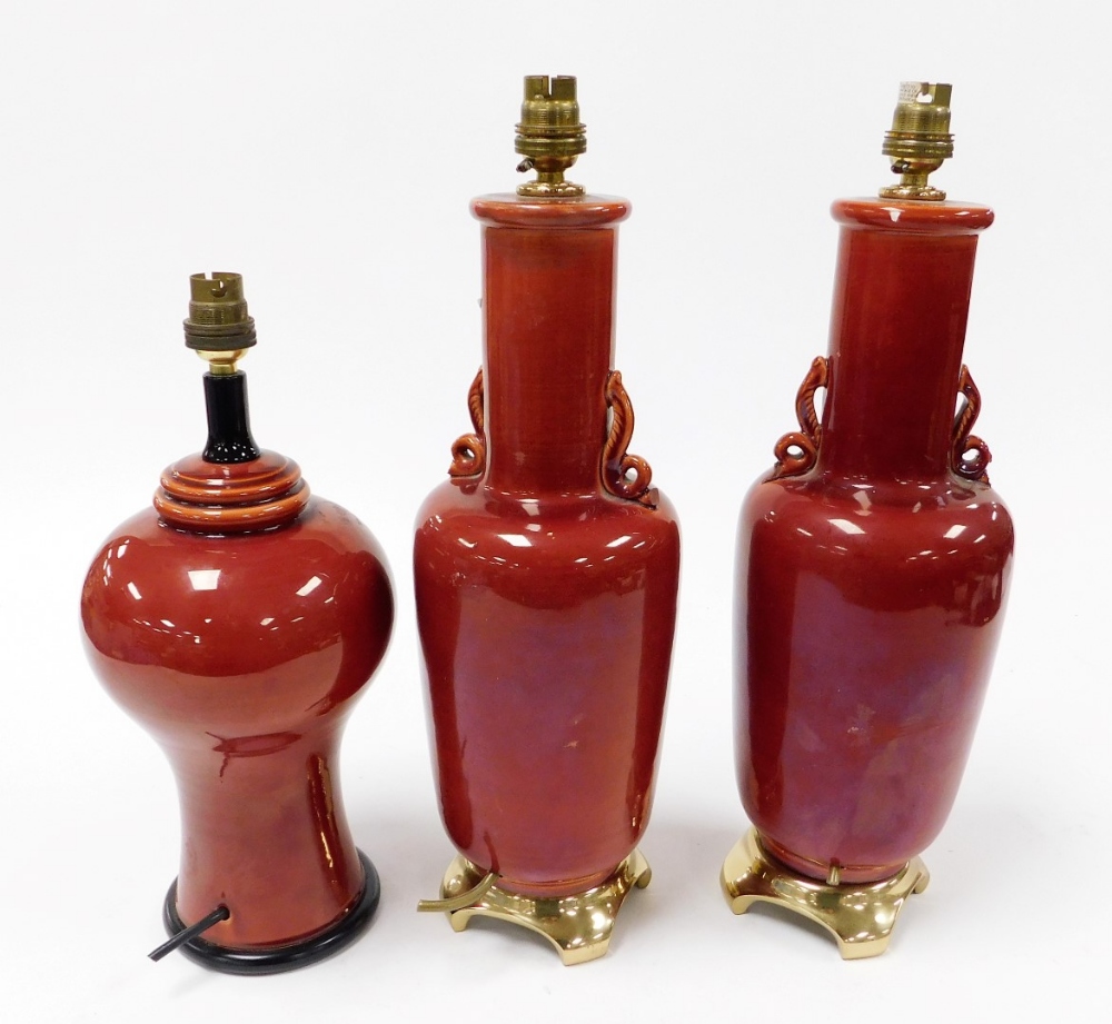 A pair of Oriental style red glazed pottery table lamps, on scrolling brass bases, 44cm high, and a - Image 2 of 3