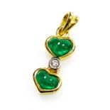 A double heart shaped emerald and diamond pendant, 1cm long, 1.2g all in.