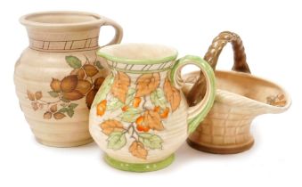 Three items of Crown Ducal Charlotte Rhead pottery, comprising a jug of ribbed form decorated with l