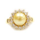A pearl and diamond set dress ring, a 7.3mm diameter cultured pearl, pinned and glued centrally, yel