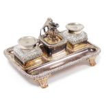 An early 19thC silver plated desk stand, with two pen recesses, pair of cut glass inkwells, with hin
