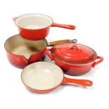 A Le Creuset red enamel saucepan, further saucepan and a sauté pan, together with a Maxwell Evans Ov