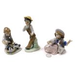 A Lladro Porcelain figure group of a girl with puppies in a basket, further figure of a girl with a