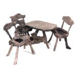 A Borneon ironwood rustic garden occasional table and three chairs. (4)