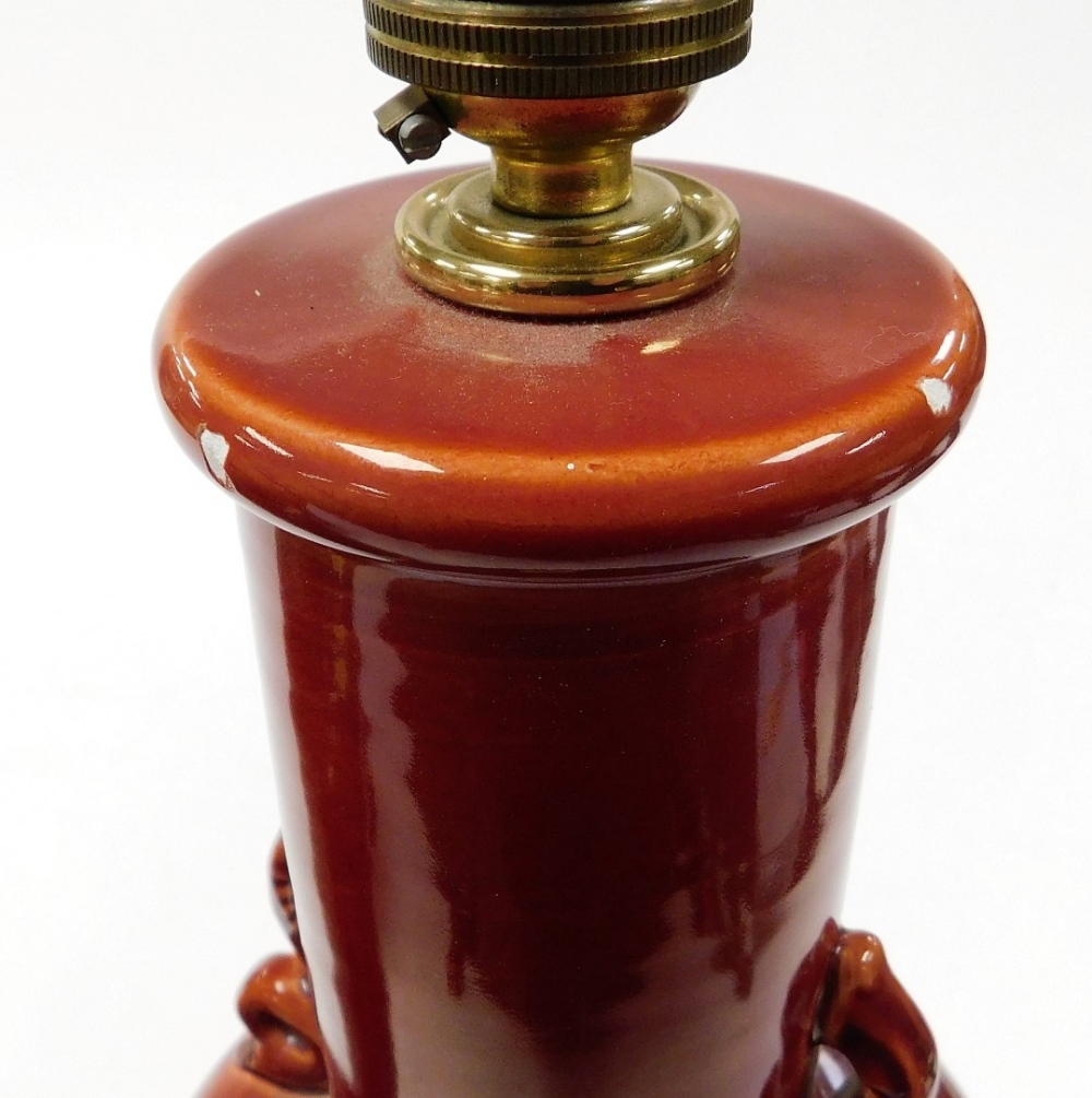 A pair of Oriental style red glazed pottery table lamps, on scrolling brass bases, 44cm high, and a - Image 3 of 3