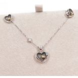 A Blossom of Copenhagen silver heart shaped pendant necklace, and pair of matching ear studs, boxed.