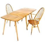 An Ercol light elm drop leaf and extending dining table, in two sections, the drop leaf table raised