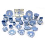 A group of Wedgwood blue jasperware, to include a pair of jugs, 10cm high, a pair of jugs decorated