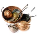 A group of copperware, including saucepans, a jelly mould, copper kettles, and a cooking pot. (a qua