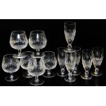 A set of six Waterford Colleen pattern cut glass champagne flutes, together with six brandy balloons