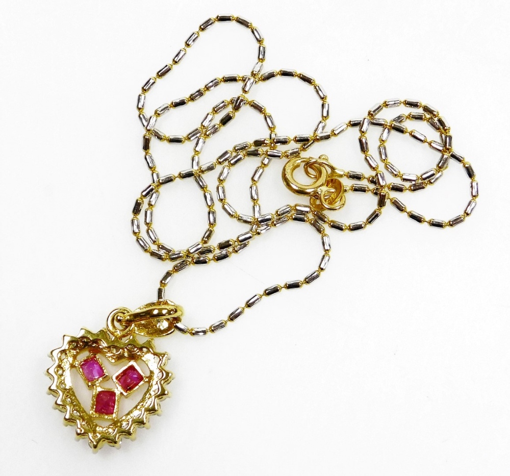 A heart shaped ruby diamond set pendant on chain, three small rectangular rubies surrounded by tiny - Image 3 of 3