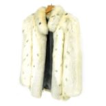 A lady's Arctic fox fur coat, under arm measurement 47cm wide.