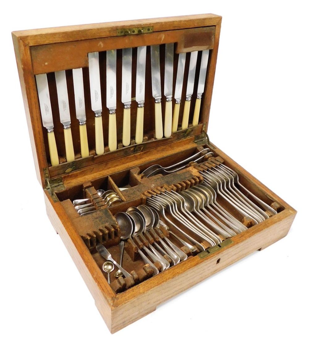 An Elkington silver plated canteen of cutlery, oak cased, with key, 43cm wide.