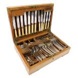 An Elkington silver plated canteen of cutlery, oak cased, with key, 43cm wide.
