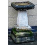 A composition bird bath, of stepped square form, 75cm high.