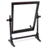 A Victorian oak swing frame toilet mirror, the frame with barley twist supports, 53.5cm high, 41cm w