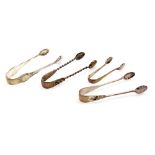 Four pairs of silver sugar tongs, comprising a pair of Victorian silver tongs of twisted form with a