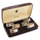 A set of six Elizabeth II silver napkin rings, of oval form with Greek key banding, Ari D Norman, Lo