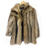 A lady's fox fur coat, under arm measurement 47cm wide.