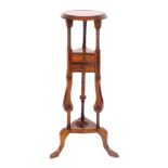 A Victorian style mahogany jardiniere stand, raised on barley twist and scroll supports, united by t
