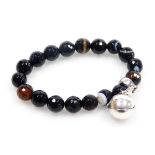 A US World Trade Centre commemorative bracelet, with faceted agate beads, and a silver ball pendant,