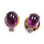 A pair of oval cabachon ruby and diamond stud earrings, the purple hue ruby of .4mm x 5.8mm approx t