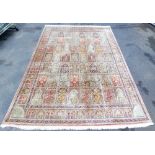 A Persian Heriz cream ground silk rug, with fifty six central panels decorated with tree of life, pl
