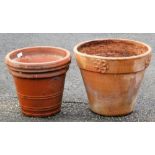 A terracotta plant pot, of tapering form, with applied floral decoration, 39cm high, and another. (2