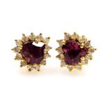A pair of tourmaline and diamond cluster ear studs, the pink heart shaped stone surrounded by tiny d