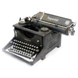 An Imperial typewriter, with qwerty keyboard, in black casing, 28cm wide.