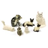 A group of pottery figures of cats, including Beswick, Kensington, and Royal Doulton. (7)