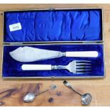 A pair of silver plated fish servers, with simulated ivory handles and silver banded mount, cased, s