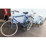 A Raleigh bicycle, in blue trim, and a Universal bicycle in pale blue trim. (AF)