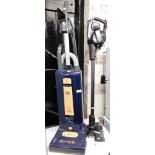 A Vax Blade II Max vacuum cleaner, and a Sebo Automatic X4 Extra upright vacuum cleaner.