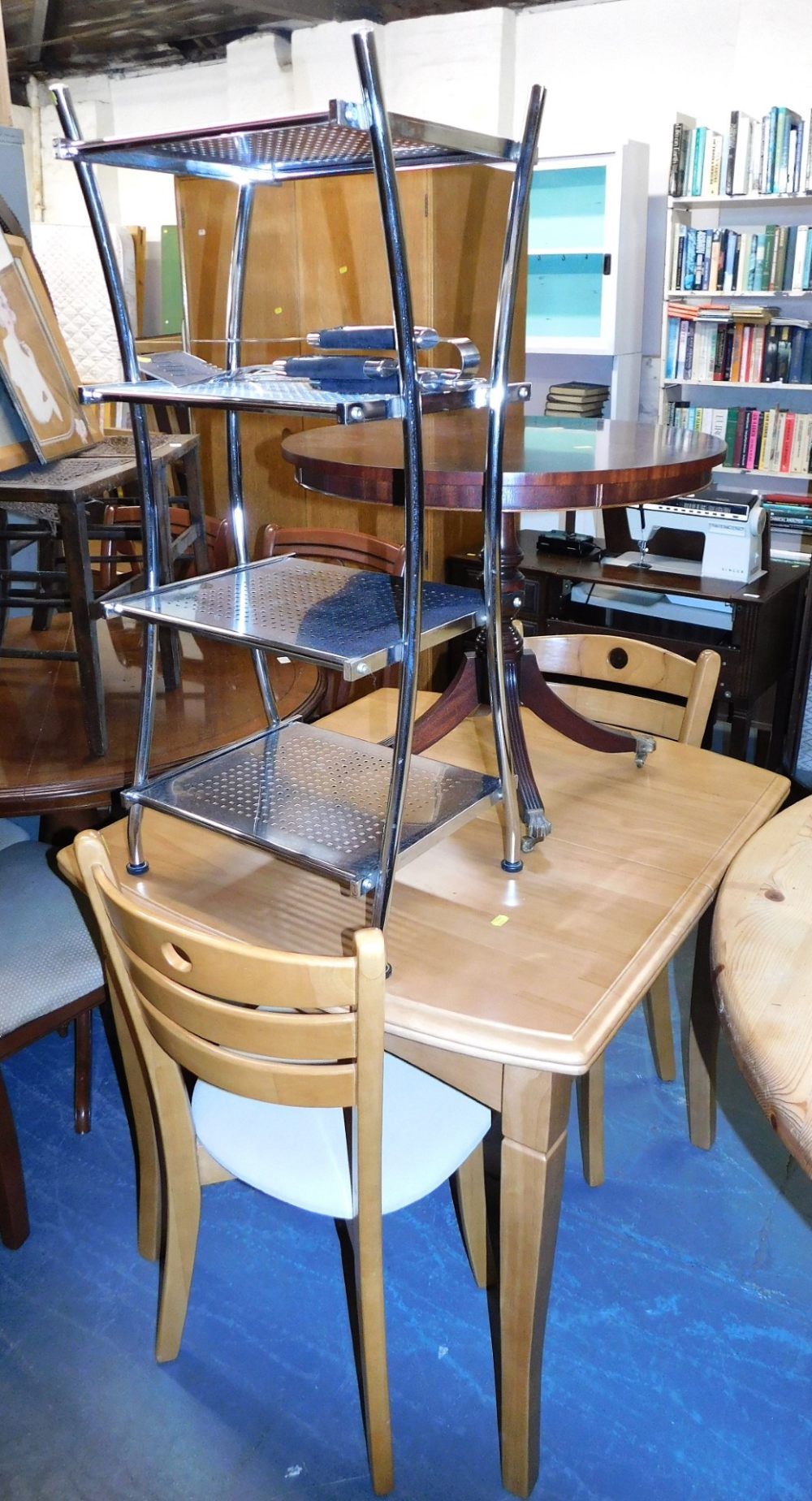 A beech extending kitchen table, 76cm high, the top 87cm x 76cm, a pair of similar chairs, a mahogan