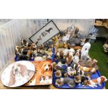 Various dog figures, predominantly Basset Hounds, pottery, and resin examples, novelty wall clocks,