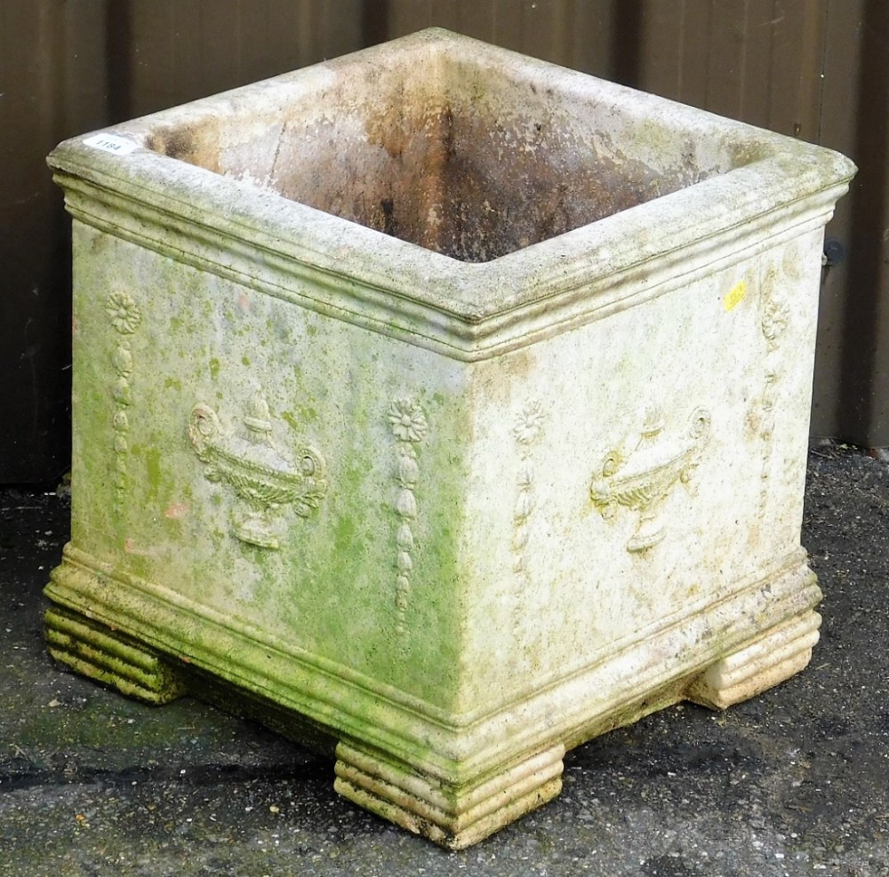 A composition garden planter, of square form, decorated with urns, 38cm high.