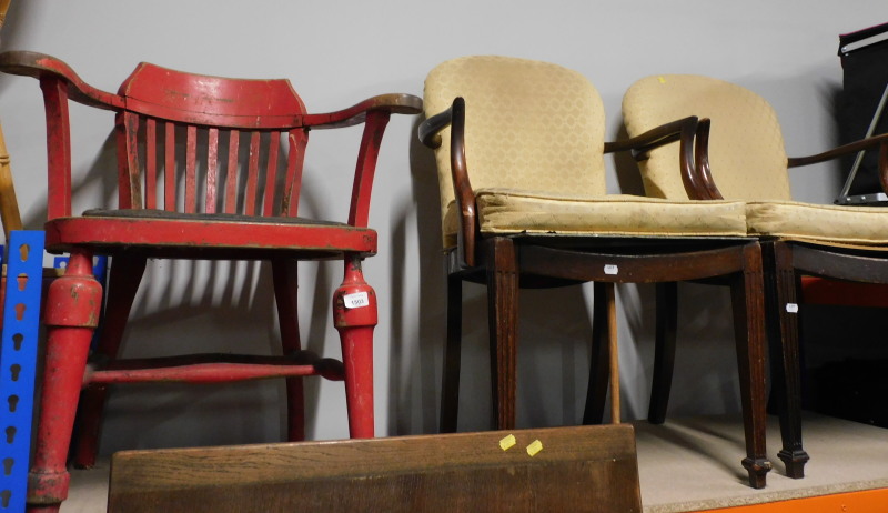 A pair of Parker-Knoll oak framed armchairs, model number 322838, and a painted captain's type chair