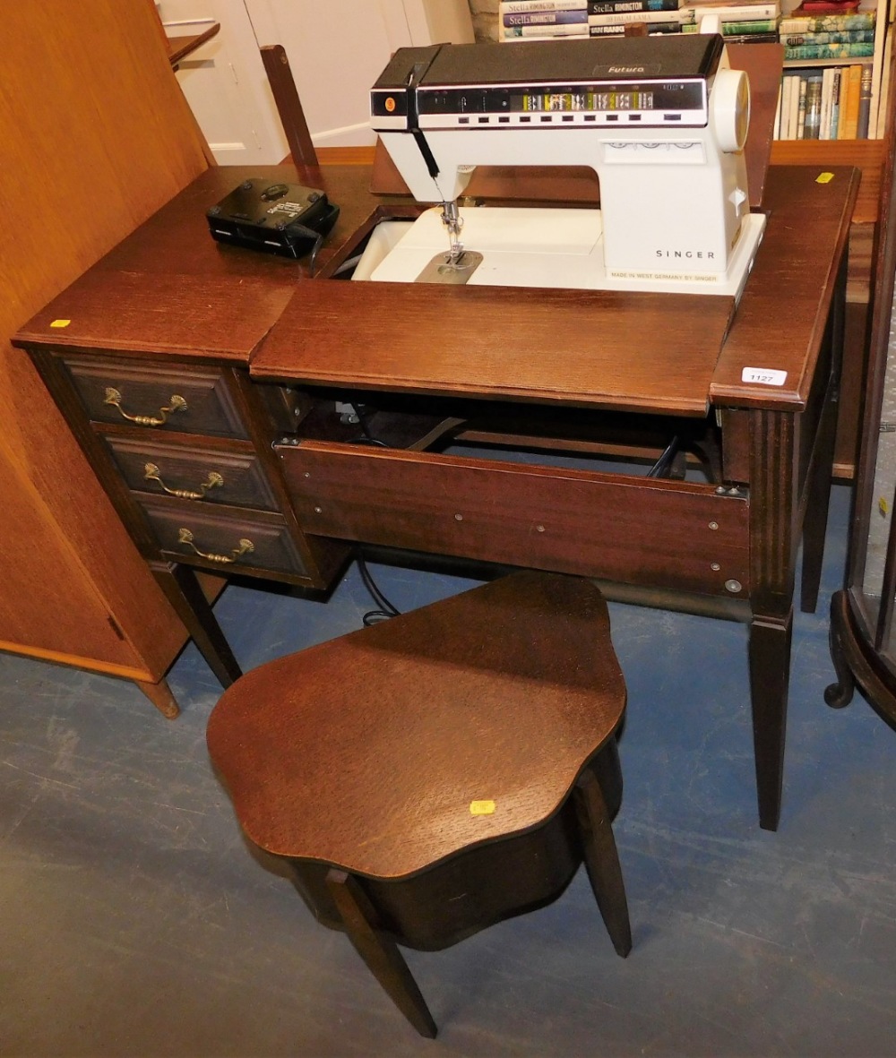 A Singer sewing machine table, and an oak sewing box, the table 93cm wide.