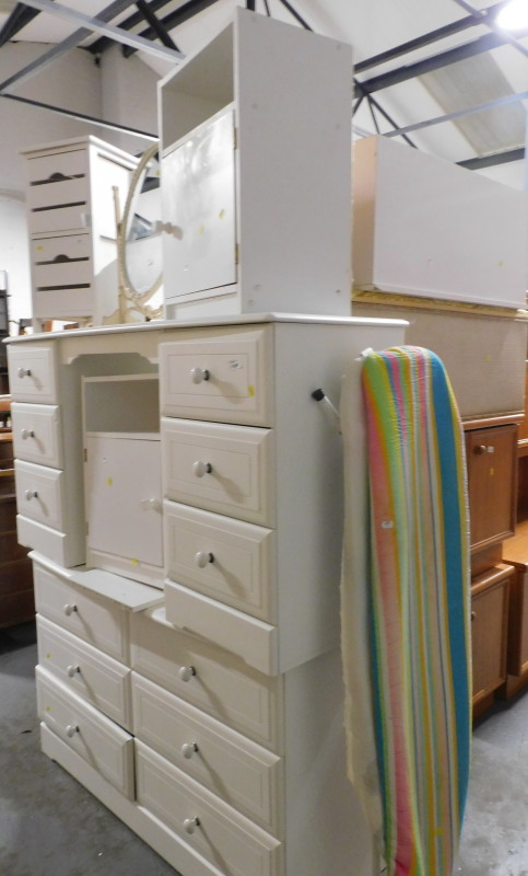 A group of white bedroom furniture, to include pedestal dressing table, chest of six drawers, bedsid