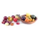 A group of ornamental fruit, comprising a ceramic lemon, avocado, apple, orange pepper, and turnip,