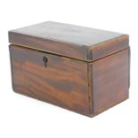 A George III mahogany tea caddy, of rectangular form, with two fitted and lidded sections with marqu