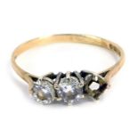 A 9ct gold CZ set three stone ring, with three stones each in six claw setting, one stone missing, i