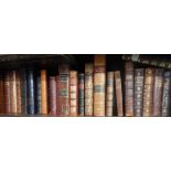 Leather and gilt bound books, including Ruskin, Monthly Magazines, Stories from Wagner, Grice's Deci